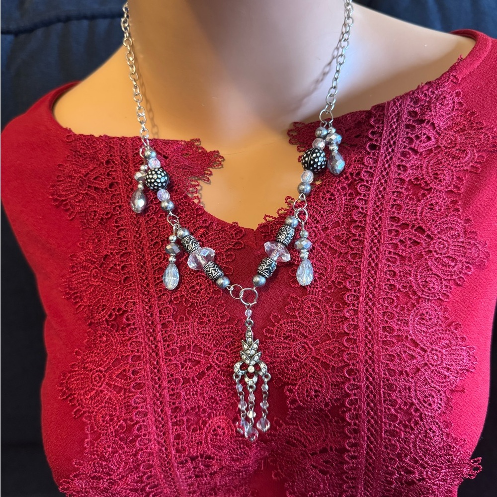 Silvertone beaded ornate necklace with decorative tassel pendant